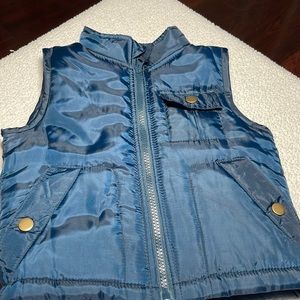Brooklyn Boys blue zip up puffer vest, small snap pocket on left side of vest